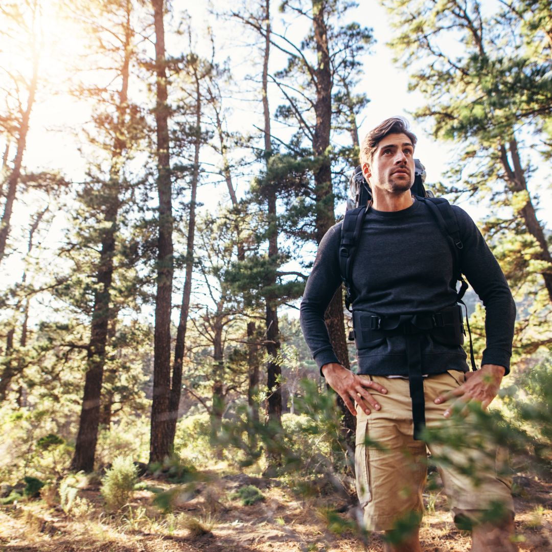man hiking in the woods
